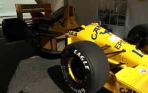 Restored Lotus 102 Formula One car in Camel livery at Great British Sports Cars workshop